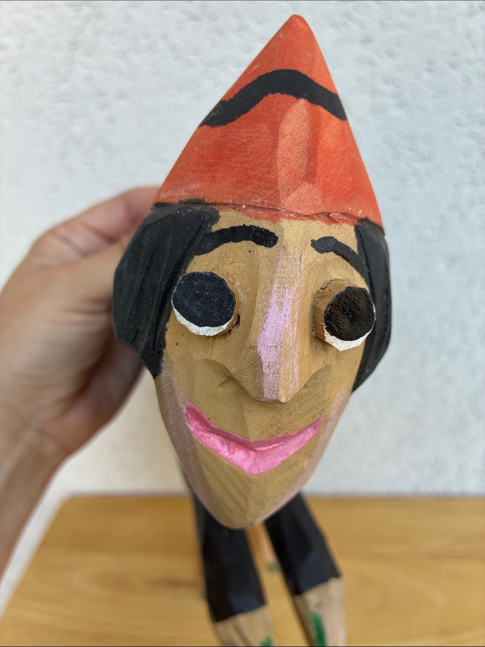 Strange hand carved folk art character with bland and orange clothes and a hook - Picture 5 of 13